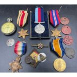 A WW I/II group of 5 medals to include The Africa Star, Victory Medal, Battle of Britain Star, WW