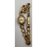 A 9 carat gold cased Regency ladies wristwatch with a 9 carat gold chain bracelet. Total weight 10.