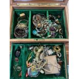 A carved wooden box and contents of vintage costume jewellery to include Victorian jet pendant