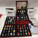 A collector's display case to include DeAgostini 80 x Zippo lighters and other loose Zippos together