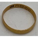 A 22 carat gold wedding band. Size K. Weight 1.1gm.