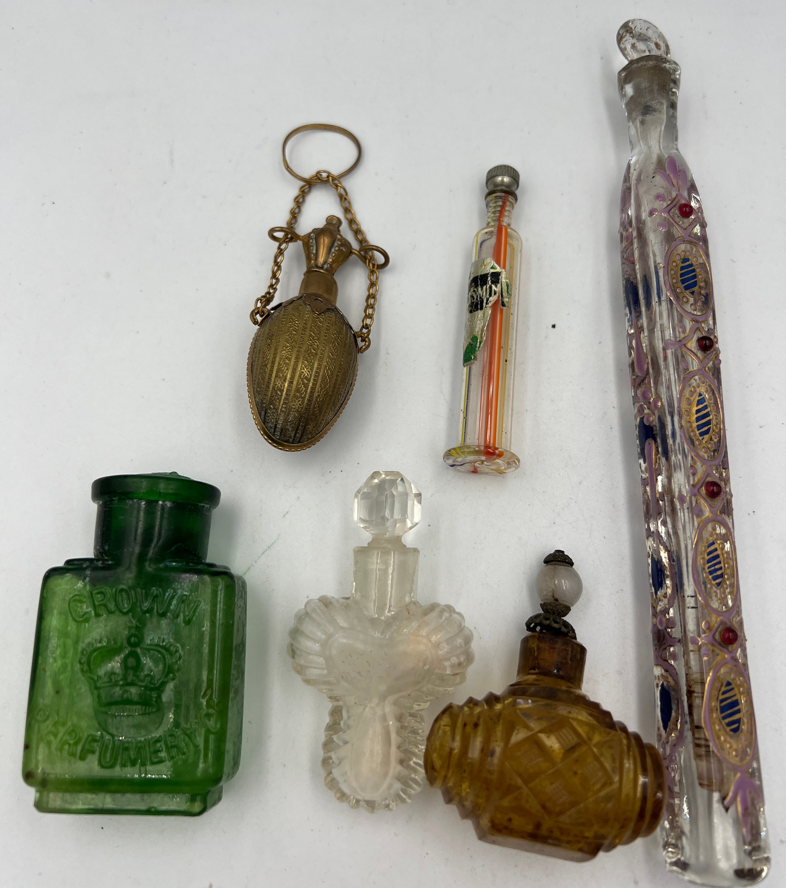 Six various glass and brass scent bottles to include Murano, Crown Perfumery and a brass egg