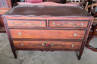 An American chest of two short over two long drawers with painted floral decoration to front.