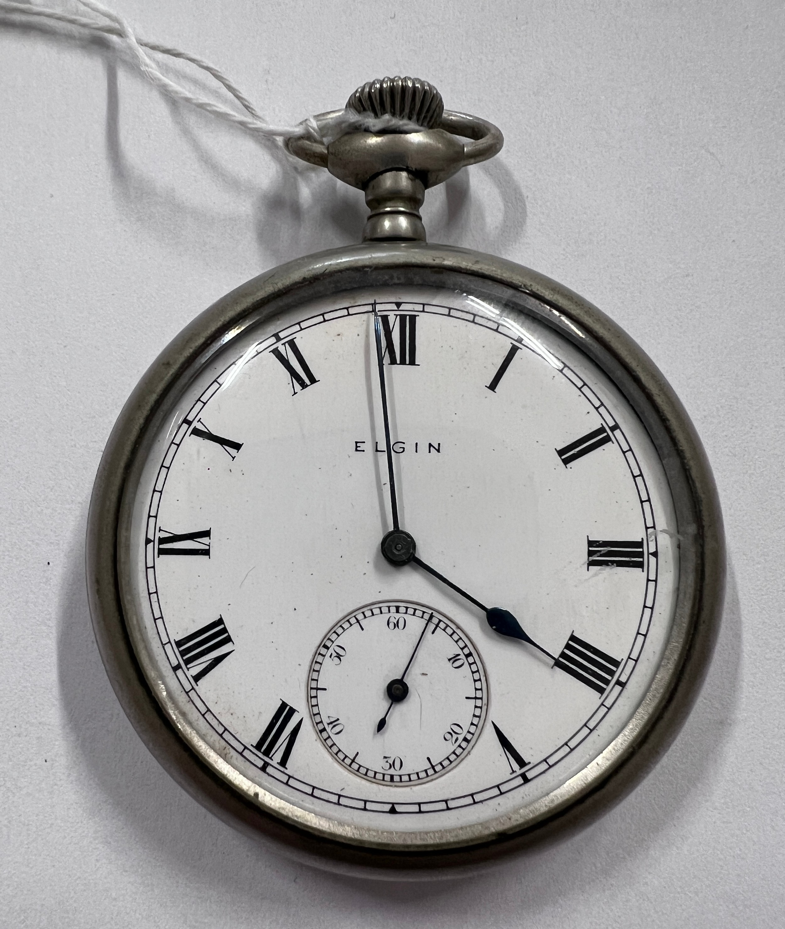 An Elgin pocket watch. Winds and goes.