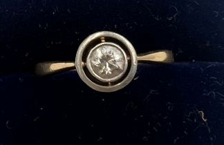 An 18 carat gold solitaire diamond ring. Size K. Weight 2.2gm.