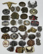 Collection of 34 belt buckles, mainly in brass with Native American designs, eagles, motorbikes etc.