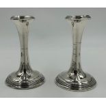 A pair of hallmarked silver candlesticks Birmingham 19ll by S. Blanckensee & Son Ltd. 12cm h. With