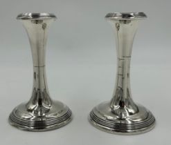 A pair of hallmarked silver candlesticks Birmingham 19ll by S. Blanckensee & Son Ltd. 12cm h. With