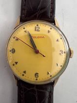 A Bulova 1951 gentleman's wristwatch, 10k gold filled with red second hand on alligator calf strap
