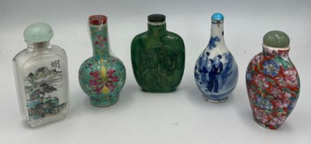 Five Chinese snuff bottles to include one inside painted glass, three porcelain and one carved