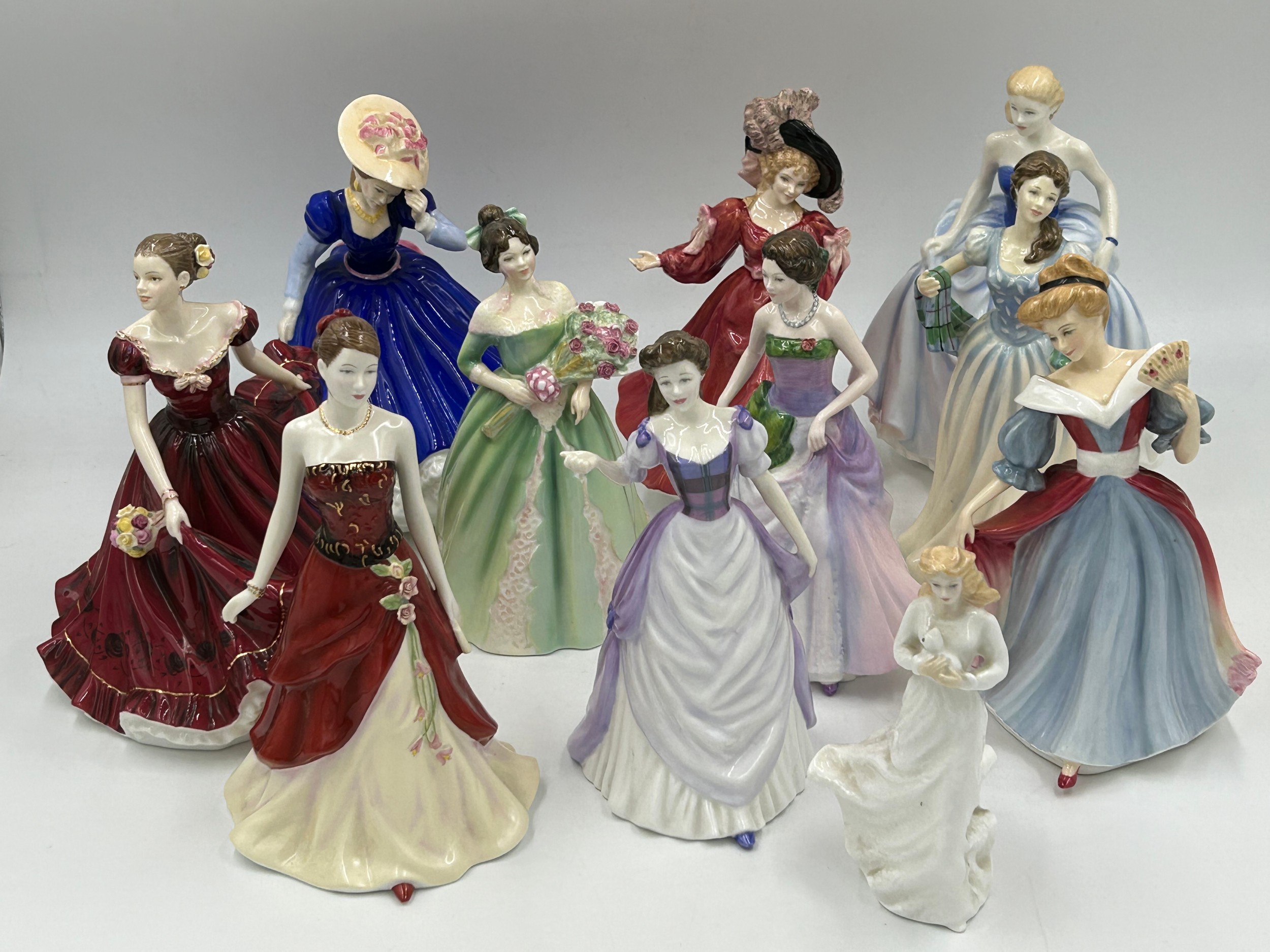 Eleven Royal Doulton figurines to include: Figure of the Year 2004 Classics Susan HN4532,1993