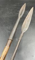 Two Zulu throwing spears. Longest with slender leaf shaped spear tip and long socket, full spearhead