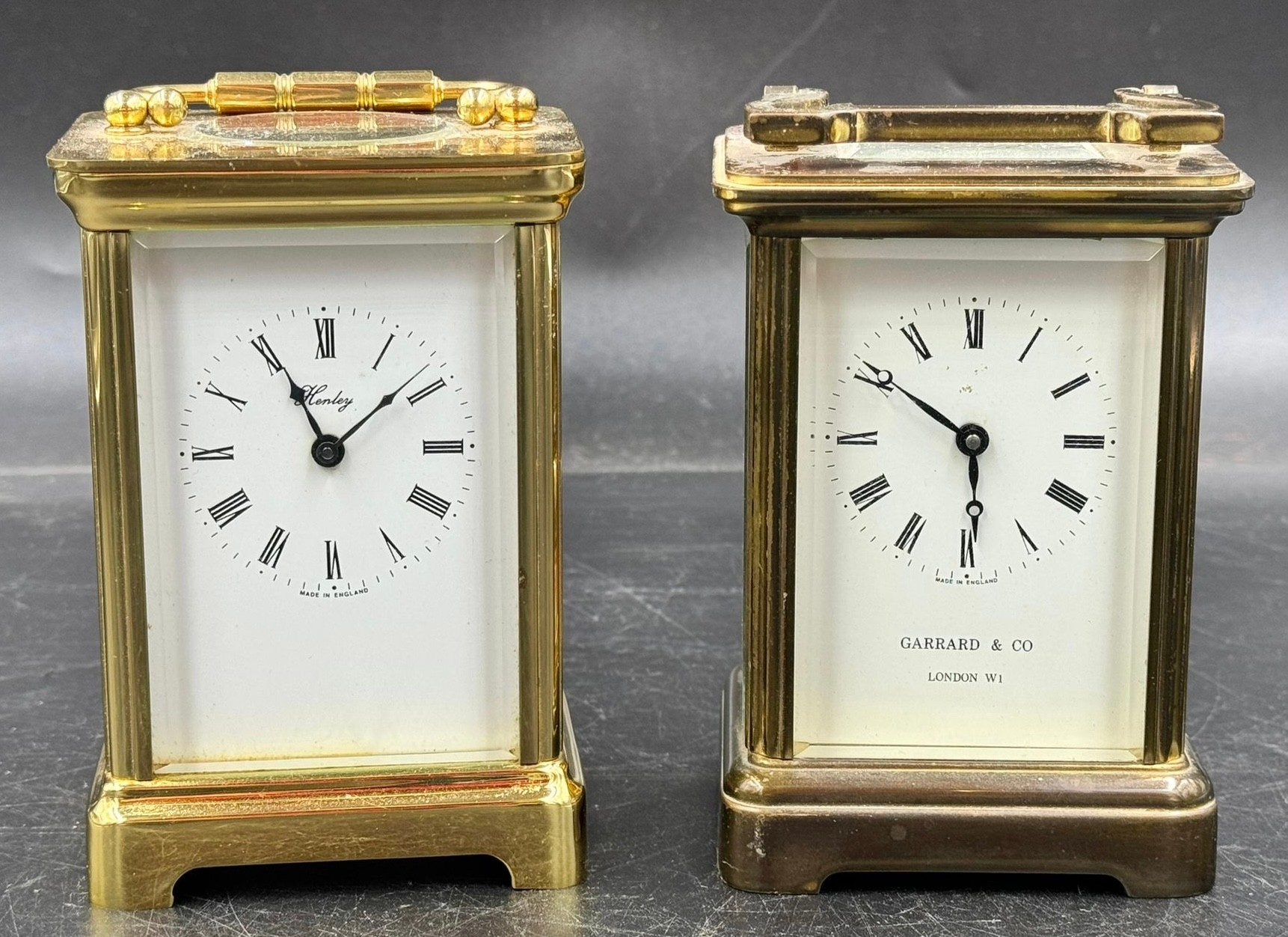 Two brass case carriage clocks to include Garrad & Co London W1 and Henley England marked to back