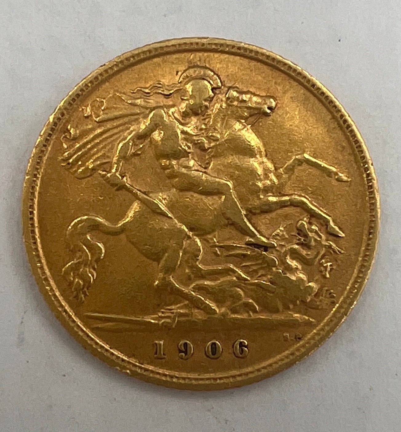 A 1906 Edwardian half sovereign.