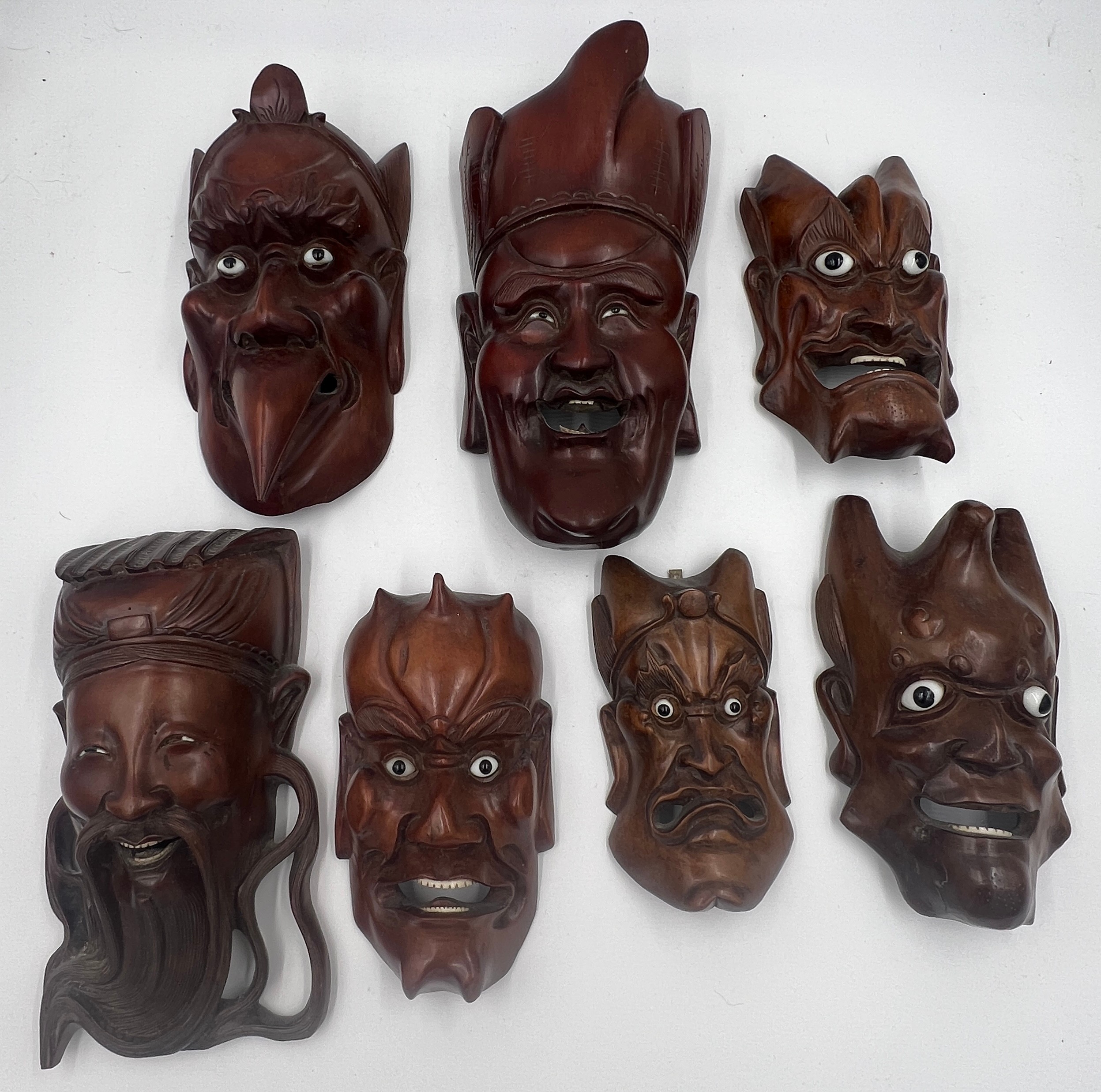 Seven various oriental hardwood masks. Largest 29cm l. - Image 2 of 3