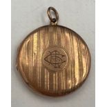 A 9 carat gold circular locket. 2.5cm d. Weight 5.3gm.