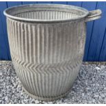 A vintage galvanised dolly tub with soap holder. Marked 1944 to base. 46cm d x 84cm h.