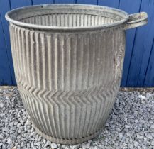 A vintage galvanised dolly tub with soap holder. Marked 1944 to base. 46cm d x 84cm h.