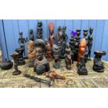 Tribal figures to include a pair of candlesticks, lidded bowl etc. Tallest 42cm h. (27)