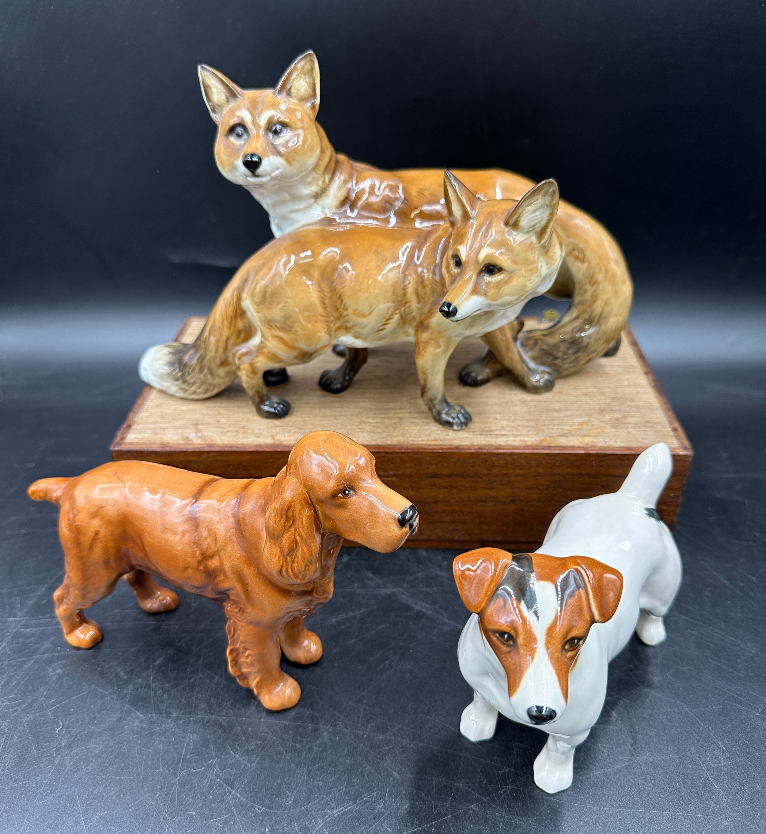 A German Hutschenreuther porcelain figure group modelled as a pair of foxes, 17cm h x approx. 18cm w
