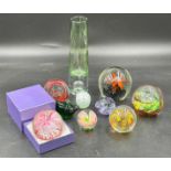 A collection of glass paperweights to include one Selkirk, 2x Caithness, together with a glass vase.