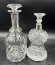 Two silver necked glass decanters to include Sheffield 1901, maker Walker and Hall and Sheffield