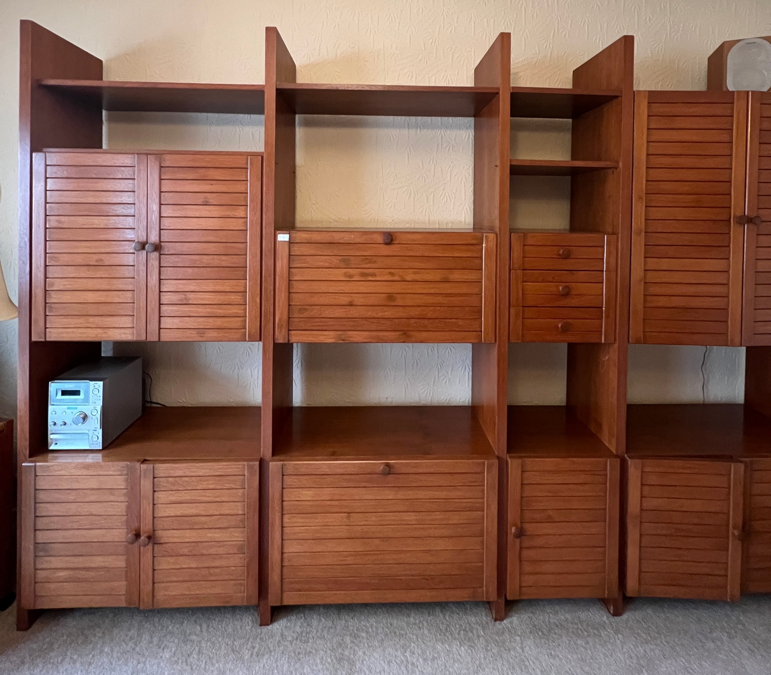 A mid 20thC modular teak bookcase with seven cupboards and three small drawers. 299cm w x 211cm h - Image 2 of 3