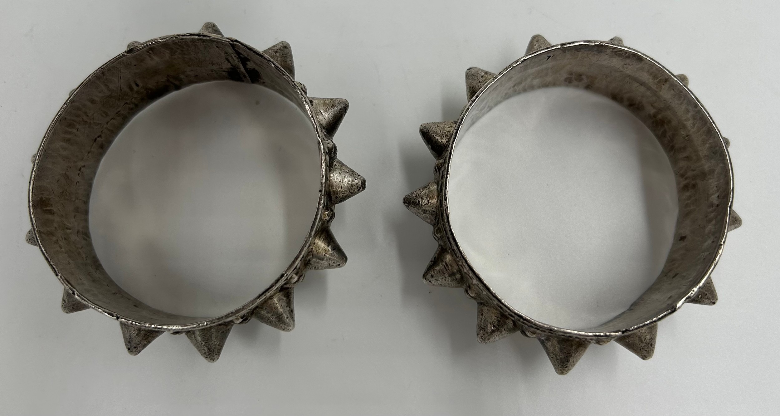 A pair of white metal Omani fertility bracelets. 147gm. 6.2cm approx. - Image 2 of 3