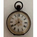 A ladies continental pocket watch with white enamel dial. Inscribed to interior 13th Feb 1911. 3cm