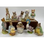 Ten Beswick Beatrix Potter figures comprising: Lady Mouse, Hunca Munca Sweeping, Samuel Whiskers,