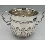 A hallmarked silver porringer. Sheffield 1929, maker William Hutton & Sons Ltd. 10cm h. Weight