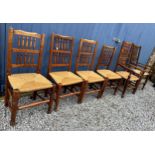 Six elm chairs, two carvers and four single, with rush seats. One carver approx. 110cm h x 59cm w (