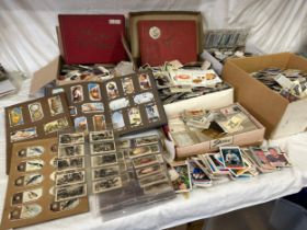 A vast quantity of loose cigarette cards to include five part filled albums, Wills Time & Money,