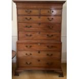 An early 19thC mahogany chest on chest of two short over six long drawers with brass swan necked