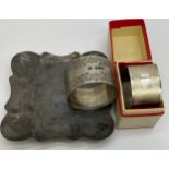 Silver dish, Birmingham 1968 and two silver napkin rings, London 1903 and 1970. Total weight 128gm.
