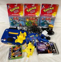 A Nintendo 64 Pikachu Pokémon games console with Pikachu controllers and 2 others, a Xena Warrior