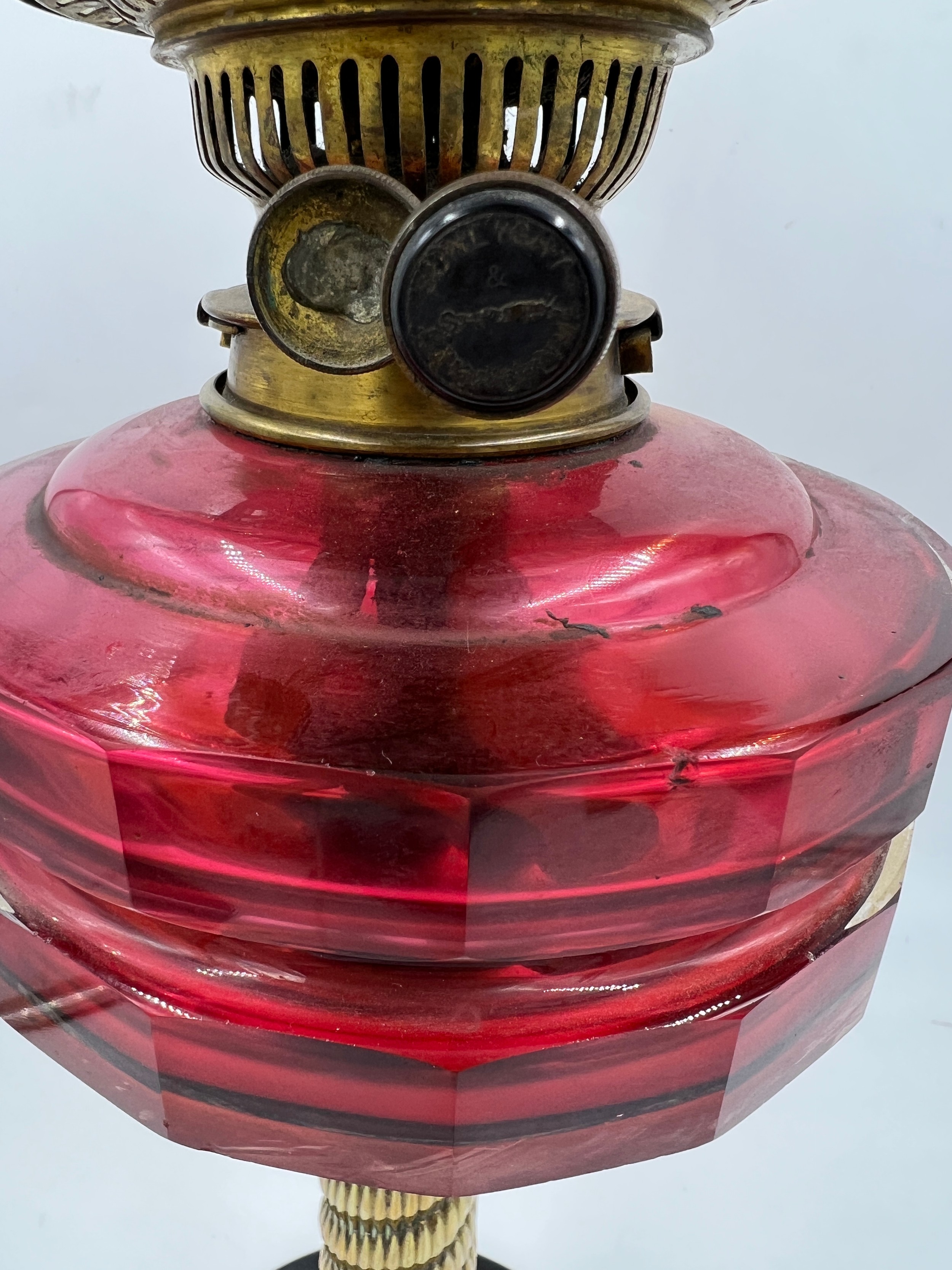 A 19thC cranberry glass and brass oil lamp on black ceramic base with etched glass shade and clear - Image 3 of 3