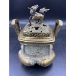 A Chinese brass incense burner with Dragon and Dog decoration. Mark to base. 23cm h.