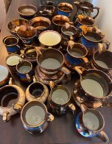 A large quantity of mainly 19thC copper lustre ceramics.