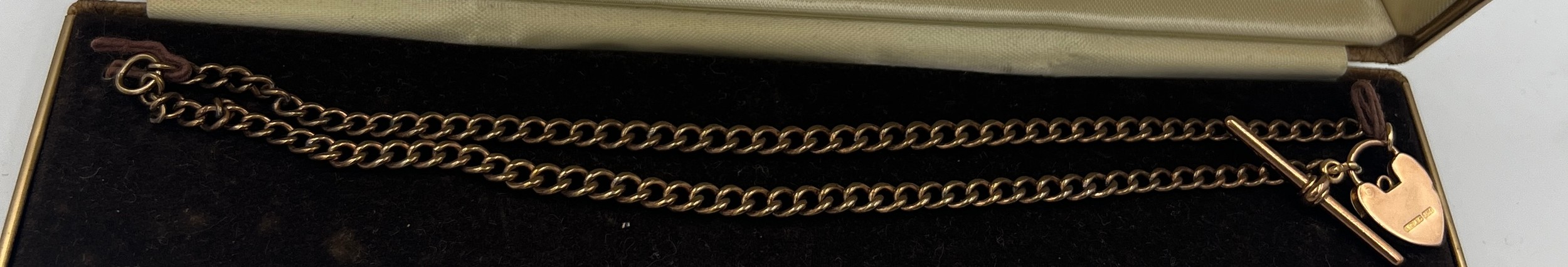 A nine carat gold clasp and T bar with unmarked yellow metal chain. Total weight 16.1gm.