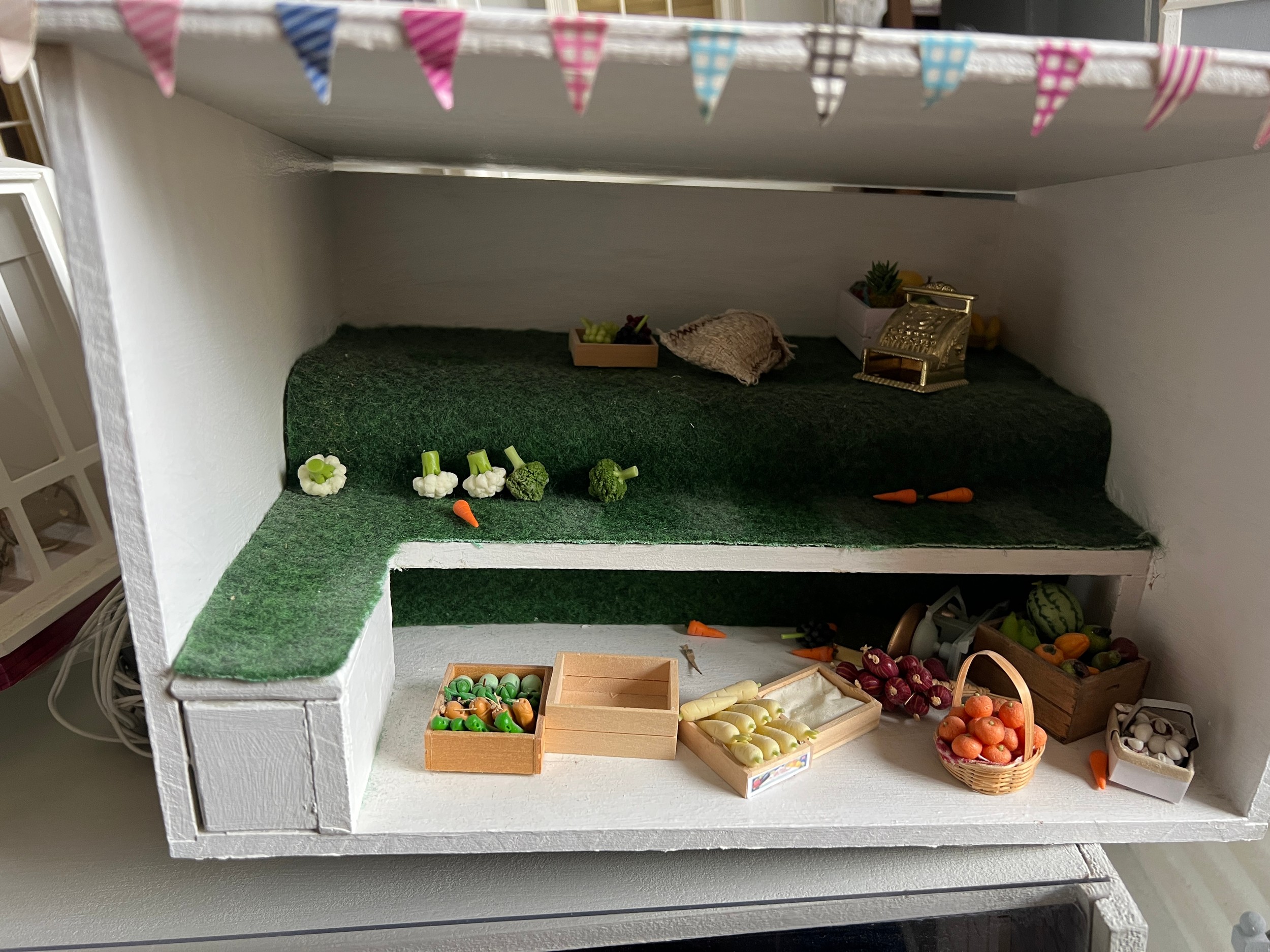 A modern dolls house, 61cm w x 83cm h x 31cm w together with bakers shop, music room, shop with - Image 10 of 12