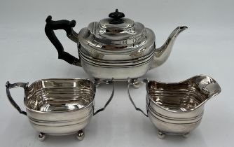 A three piece silver tea service with ebony handle and knop, London 1900, maker TB. Total weight