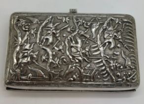 A Chinese silver cigarette case with repoussé decoration, a fight scene to one side, dragon to the