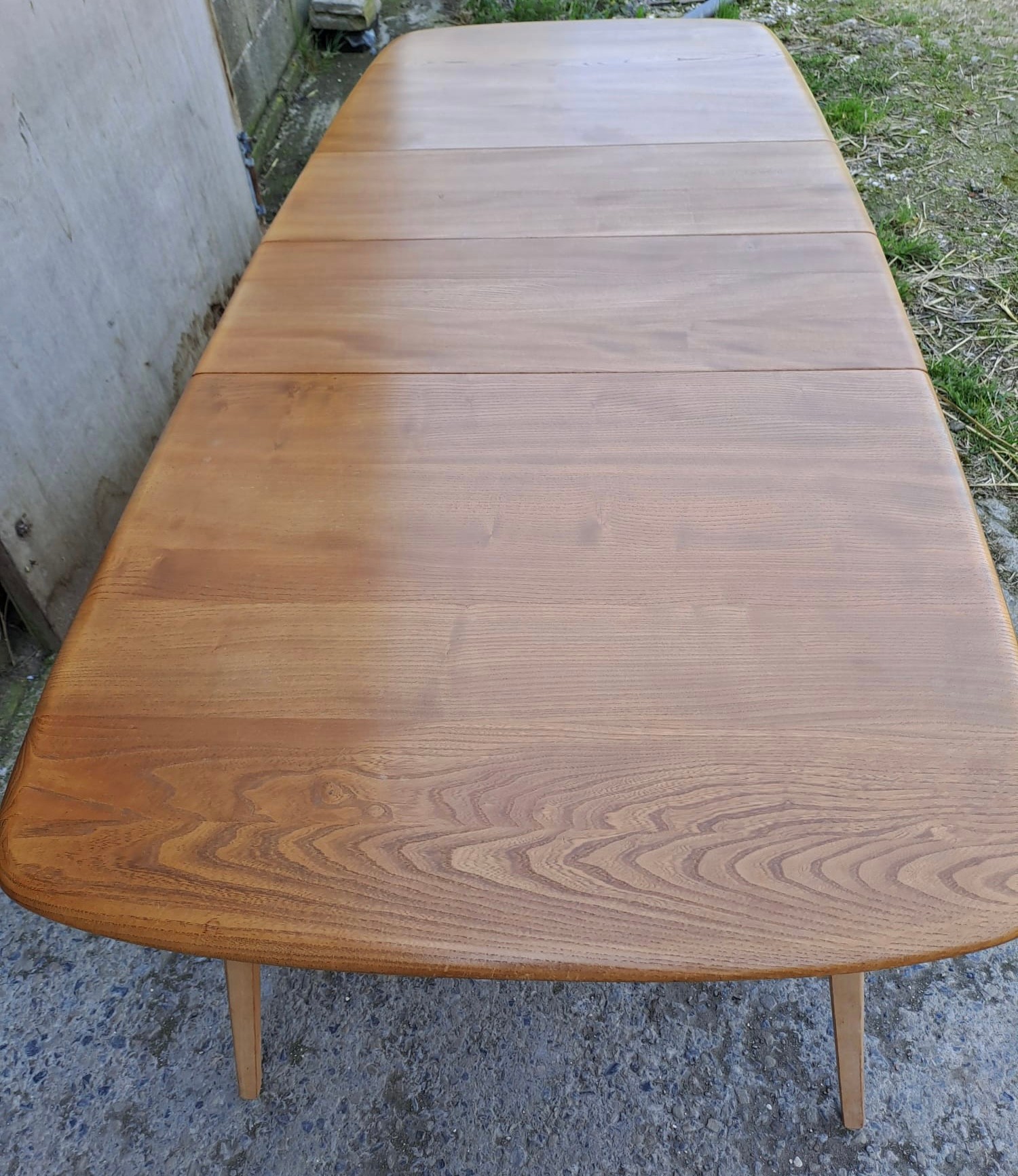 A mid 20thC Ercol extending dining table. Closed 82cm h x 152cm l x 91cm w, fully open 223cm l. - Image 3 of 7