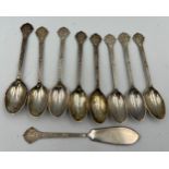 Eight silver teaspoons and a butter knife, total weight 141.5gm. Sheffield 1977, maker Cooper