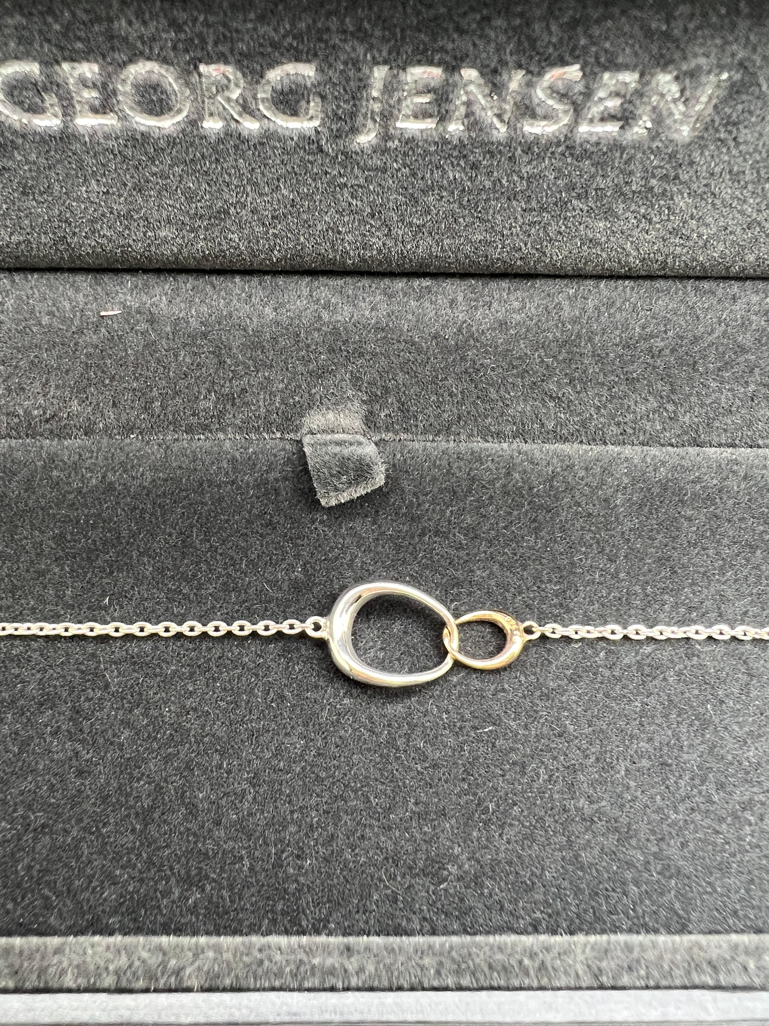 A boxed Georg Jensen Offspring .925 silver and .750 gold bracelet in original presentation box. - Image 2 of 4