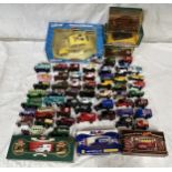 A collection of toy vehicles to include a boxed Disney Burago 1/18 scale beetle, Lledo vehicles,