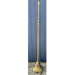 A heavy brass and copper standard lamp with circular base on 3 brass feet. 154cm h to top of