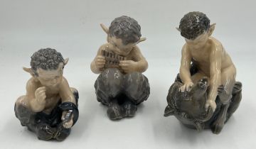 Three Royal Copenhagen figures of fawns, one fighting a bear, 648, one with snake 1742 and one