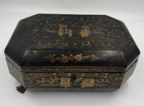 A Chinese lacquer box and contents to include mah-jong counters etc. Box 32cm x 21cm.
